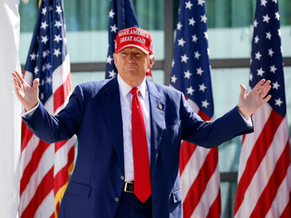 Republican presidential candidate former President Donald Trump enters at a campaign event