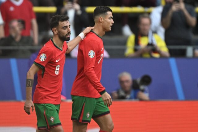 Bruno Fernandes and Cristiano Ronaldo celebrate together after the duo combined for Portug