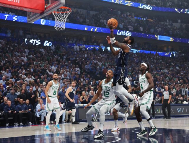 Dallas star Kyrie Irving puts up a shot in the Mavericks' blowout of the Boston Celtics in