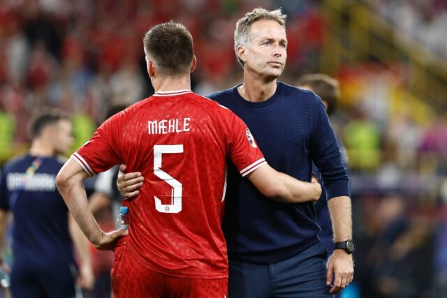 Denmark coach Kasper Hjulmand with Joakim Maehle after the 2-0 loss to Germany which saw t