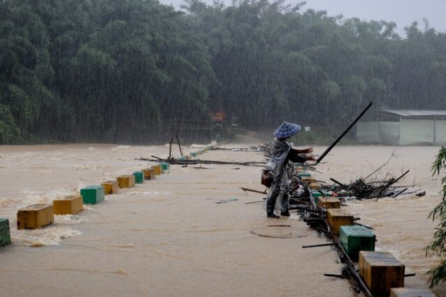 Over a dozen people were missing in China on Tuesday after heavy rains and flooding struck