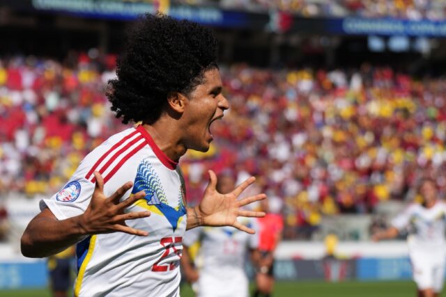 Eduard Bello of Venezuela celebrates after scoring his team's second goal in the 2-1 win o