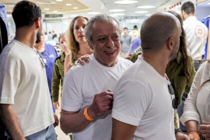 The father (C) of freed hostage Shlomi Ziv arrives at Sheba Medical Center near Tel Aviv