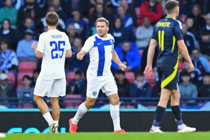 Finland striker Benjamin Kallman (centre) celebrates his goal against Scotland