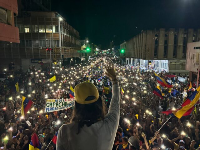 Maria Corina Machado, leader of Venezuela's opposition, waves to supporters at a campaign