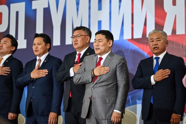 Mongolia's Prime Minister Luvsannamsrain Oyun-Erdene (centre R) participates in a rally in