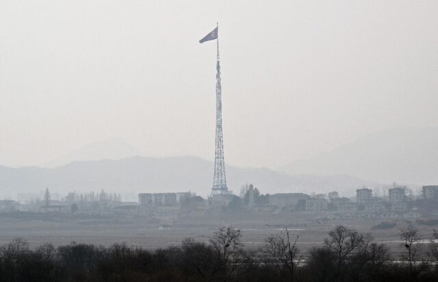 A North Korean flag is seen at the propaganda village of Gijungdong, North Korea