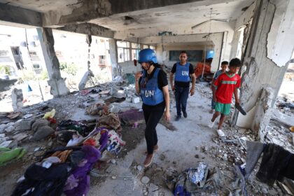 Members of a UN investigation team visit the UNRWA-run school hit by an Israeli air strike