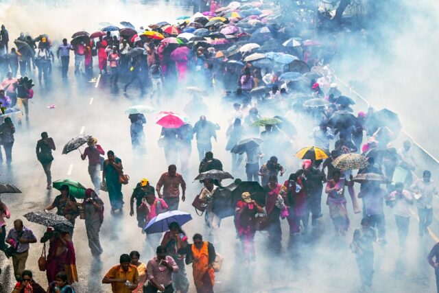 Police use water cannons and tear gas to disperse teachers striking over pay, as the consq