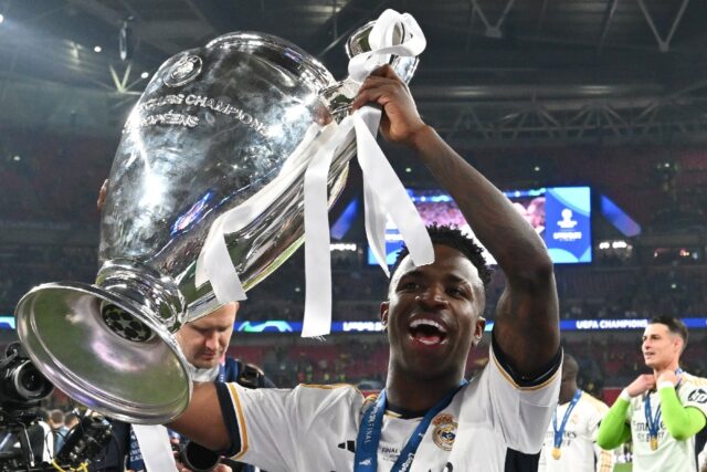 Real Madrid's Vinicius Junior lifts the Champions League trophy
