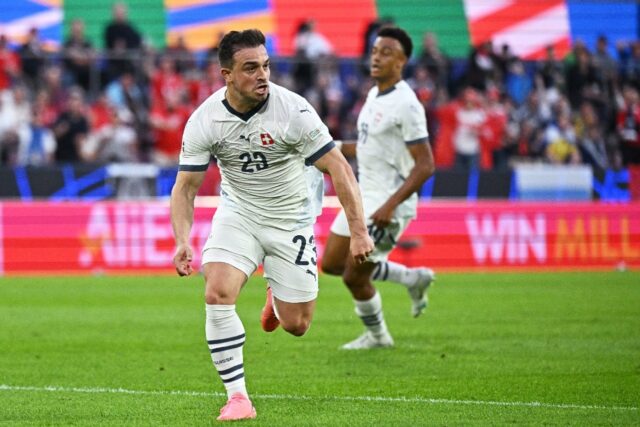 Switzerland's Xherdan Shaqiri celebrates scoring against Scotland