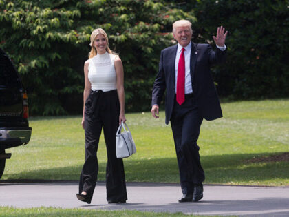 President Donald J. Trump walks along the South Lawn of the White House with daughter and