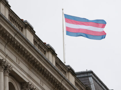 The Transgender Pride Flag flies on the Foreign Office building in London on Transgender D