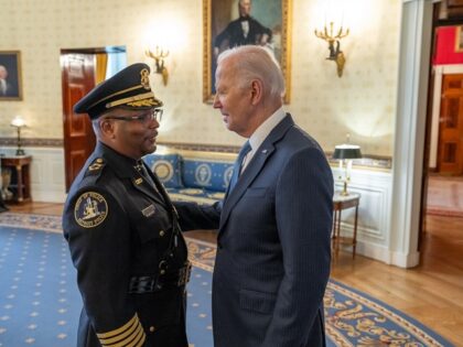 President Joe Biden speaks with Detroit Police Chief James White in the Blue Room of the W