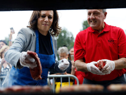 Democratic presidential candidate Kamala Harris, D-Calif., works the grill during the Polk