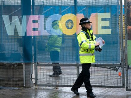 A police officer stands outside the Manchester Central Convention Complex before the Conse