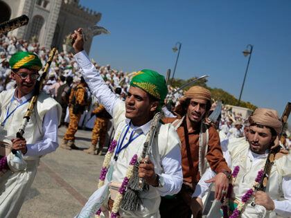 Thousands of Yemeni grooms dressed in traditional attire participate in a mass wedding, he
