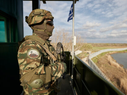 In this photo provided by the Greek Prime Minister's Office, a Greek soldier guards over a