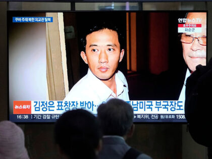 A TV screen shows a file image of Ri Il Kyu, a senior North Korea diplomat based in Cuba,