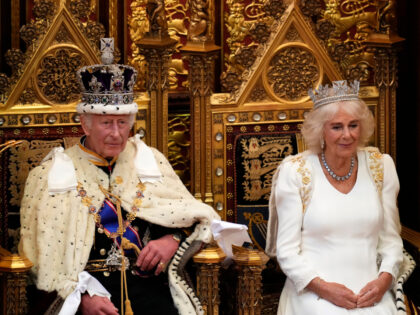 King Charles III and Queen Camilla sit on their thrones ahead of the king making his speec