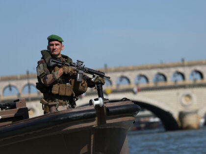 A soldier patrols on the Seine river, Wednesday, July 17, 2024 in Paris. France's armed fo