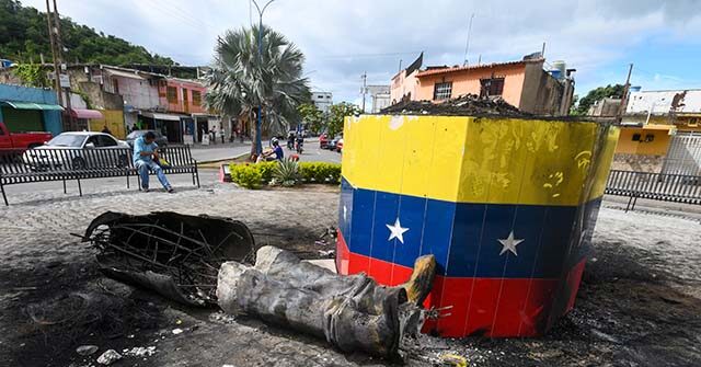 NextImg:Venezuelans Topple Statues of Hugo Chavez in Nationwide Anti-Socialist Protests