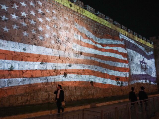 Israeli authorities project an image of the Israeli and U.S. flags on the walls of Jerusal