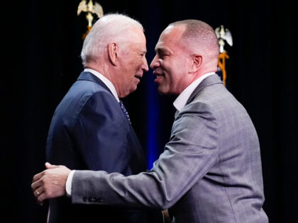 President Joe Biden steps on stage to speak to the …