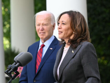 US President Joe Biden looks on as Vice President Kamala Harris delivers remarks at a rece
