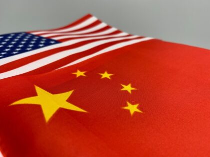 Chinese flag over American flag