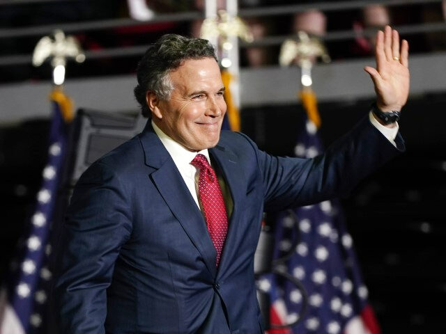 Republican Senate candidate Dave McCormick walks on stage to speak at a campaign rally for