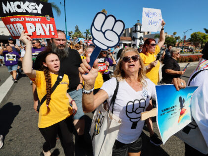 Anaheim, CA - July 17: Over 400 Disney cast members rally outside the Disneyland Main Entr