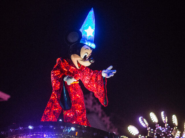 An actor dressed as Mickey Mouse performs during the "Disney Paint the Night" Ni