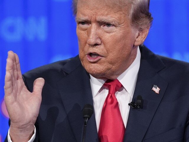 Republican presidential candidate former President Donald Trump gestures during a presiden