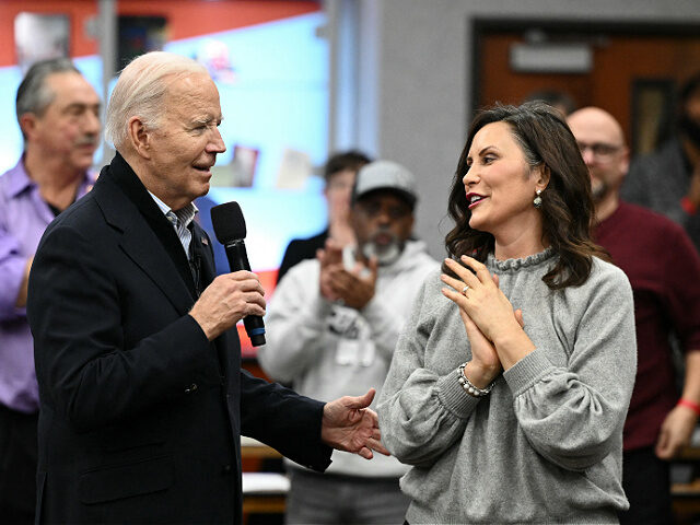 US President Joe Biden speaks alongside Michigan Governor Gretchen Whitmer (R) during a vi