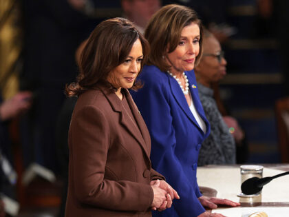 U.S. Vice President Kamala Harris (L) and Speaker of the House Nancy Pelosi (D-CA) wait fo