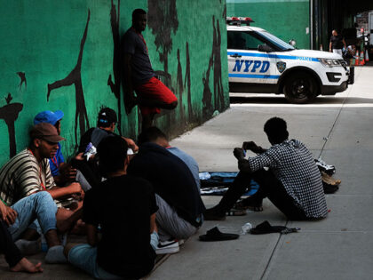 Police patrol outside of a migrant shelter in Brooklyn on July 21, 2023 in New York City.
