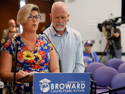 Jessica Norton, with her husband, Gary, speaks during the public comment period at a Browa