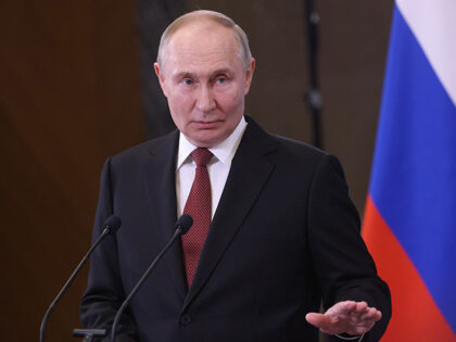 Russian President Vladimir Putin gestures during his press conference after the end of the