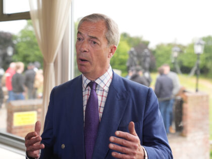 Reform UK leader Nigel Farage speaks to the media during a visit to Wyldecrest Sports Coun