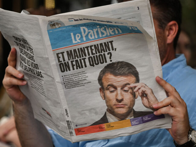 PARIS, FRANCE - JULY 08: A man reads 'Le Parisien' newspaper, seen the day afte