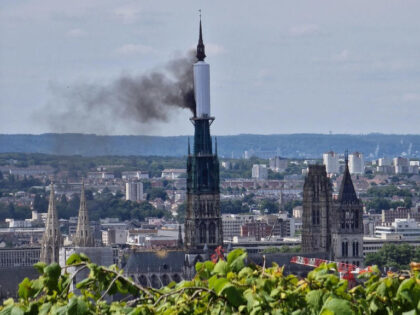 Smoke billows from the spire of Rouen Cathedral in Rouen, northern France on July 11, 2024