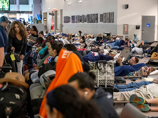 Travelers at George Bush Intercontinental Airport (IAH) in Houston, Texas, US, on Saturday