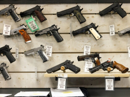 Guns for sale are displayed at Maxon Shooter's Supplies in Des Plaines, Ill., Tuesday, Jun