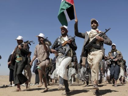 Houthi fighters march during a rally of support for the Palestinians in the Gaza Strip and