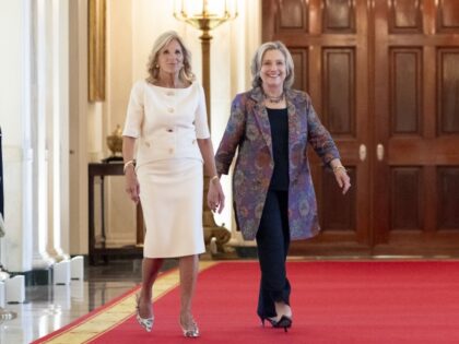 First Lady Jill Biden walks through the Cross Hall with Secretary Hillary Clinton to a Pra
