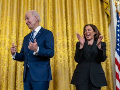 President Joe Biden and Vice President Kamala Harris react while high school senior and yo