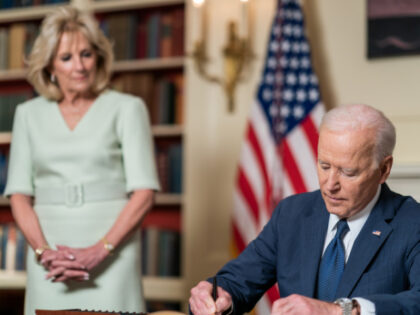 President Joe Biden, joined by First Lady Jill Biden, signs the Month of the Military Chil