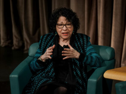 U.S. Supreme Court Justices Sonia Sotomayor, and Amy Coney Barrett, not pictured, hold a c