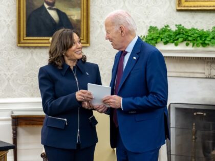 President Joe Biden talks with Vice President Kamala Harris before a meeting with Congress